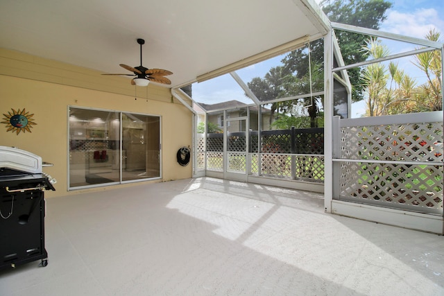 sunroom / solarium featuring ceiling fan