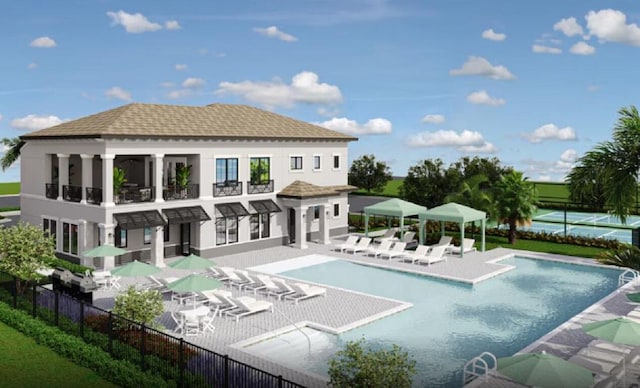 rear view of house featuring fence, stucco siding, a balcony, a community pool, and a patio