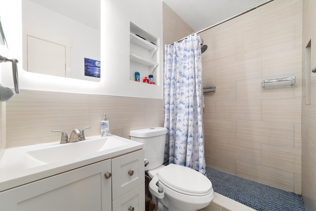 bathroom featuring vanity, toilet, tile walls, and a shower with curtain