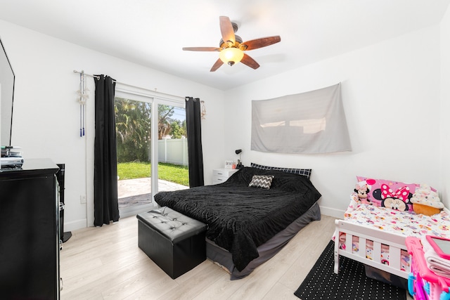 bedroom featuring light wood-type flooring, ceiling fan, and access to exterior