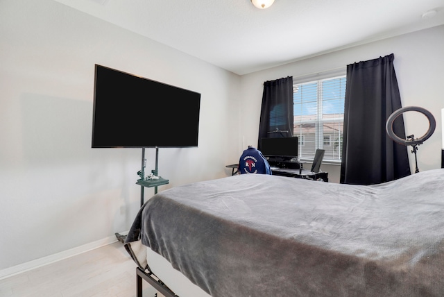 bedroom with light wood-type flooring