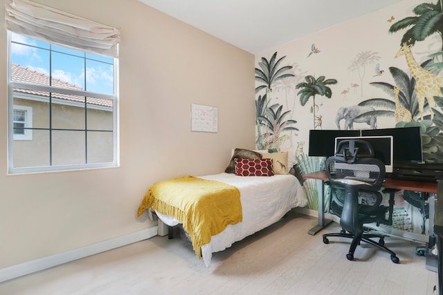 bedroom featuring hardwood / wood-style flooring