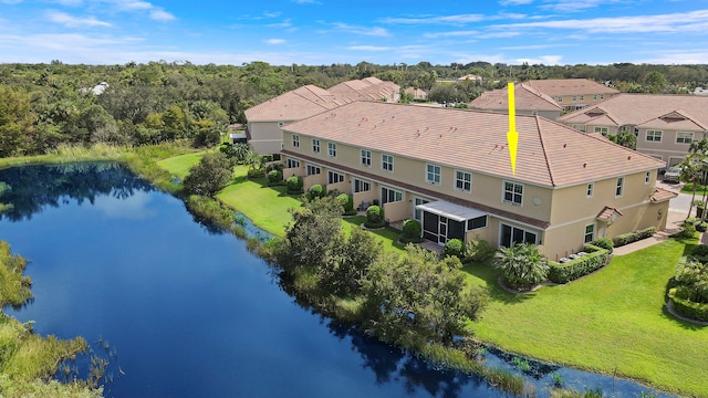 birds eye view of property featuring a water view