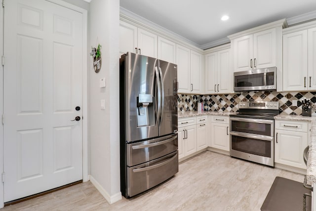 kitchen featuring light hardwood / wood-style floors, crown molding, sink, stainless steel appliances, and light stone countertops