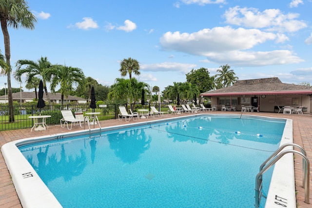 view of swimming pool with a patio