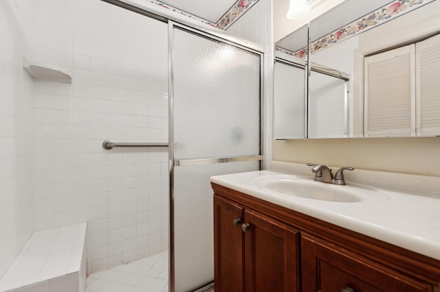 bathroom with vanity and an enclosed shower