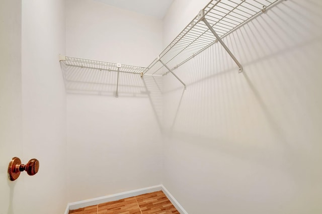 walk in closet featuring wood-type flooring