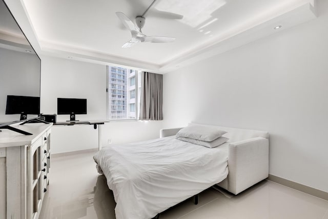 1000 W Ave Unit 502, Miami Beach, FL 33139 - bedroom featuring a tray ceiling, an office area, and a ceiling fan