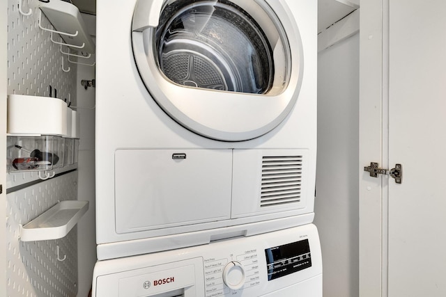 1000 W Ave Unit 502, Miami Beach, FL 33139 - washroom with stacked washer and clothes dryer
