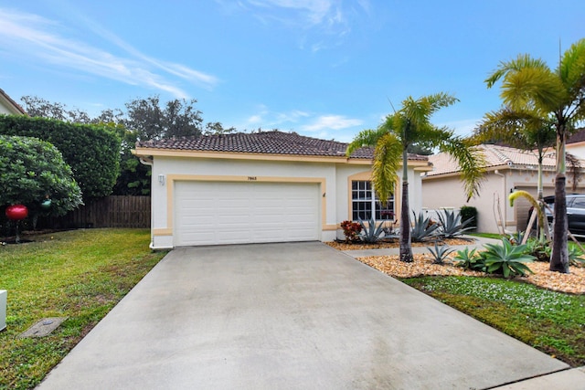 view of front of house featuring a garage and a front yard