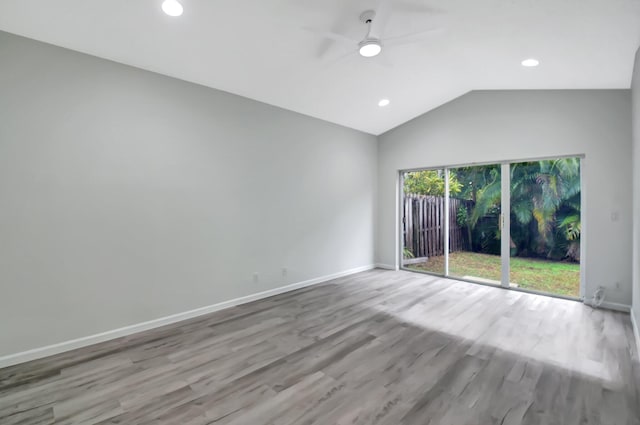 empty room with light hardwood / wood-style flooring, ceiling fan, and lofted ceiling