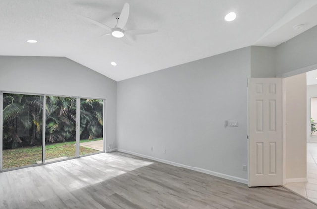 unfurnished room with ceiling fan, lofted ceiling, and light wood-type flooring