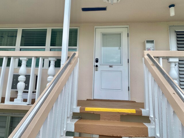 doorway to property with a balcony