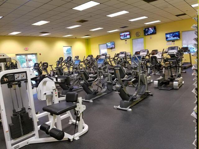 exercise room featuring a paneled ceiling