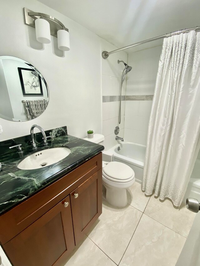 full bathroom featuring vanity, tile patterned flooring, toilet, and shower / bathtub combination with curtain