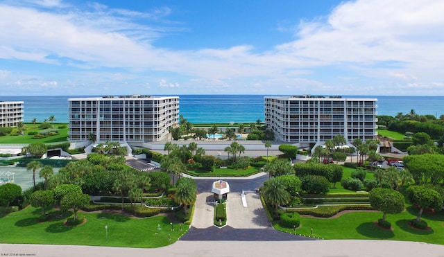 birds eye view of property with a water view