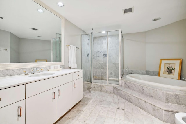 bathroom with vanity and plus walk in shower