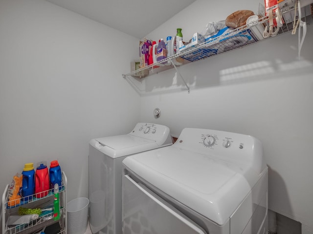 laundry area with independent washer and dryer