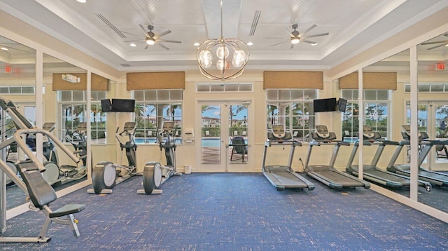 workout area featuring french doors, ceiling fan with notable chandelier, and a wealth of natural light