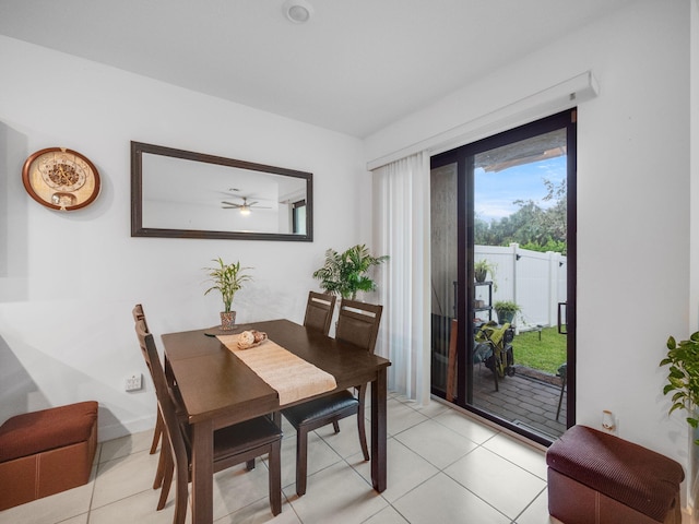 tiled dining room with ceiling fan