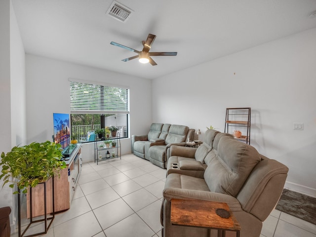 tiled living room featuring ceiling fan