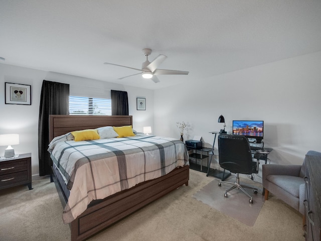 bedroom featuring ceiling fan and light colored carpet