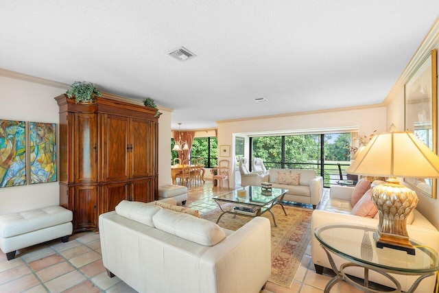 tiled living room with ornamental molding, a textured ceiling, and a notable chandelier