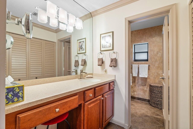 bathroom with ornamental molding, vanity, and tile patterned floors