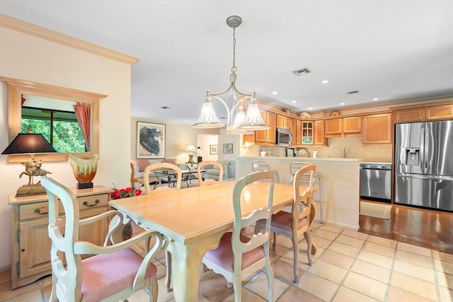 tiled dining area with crown molding