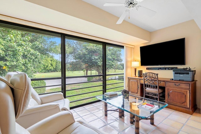 sunroom / solarium featuring ceiling fan