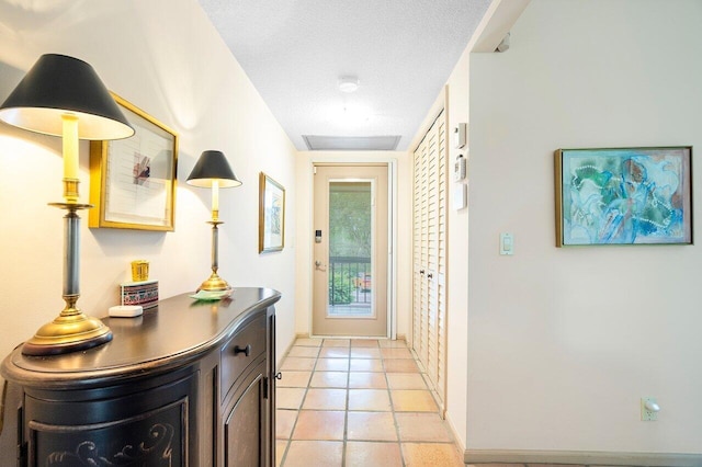 entryway featuring a textured ceiling