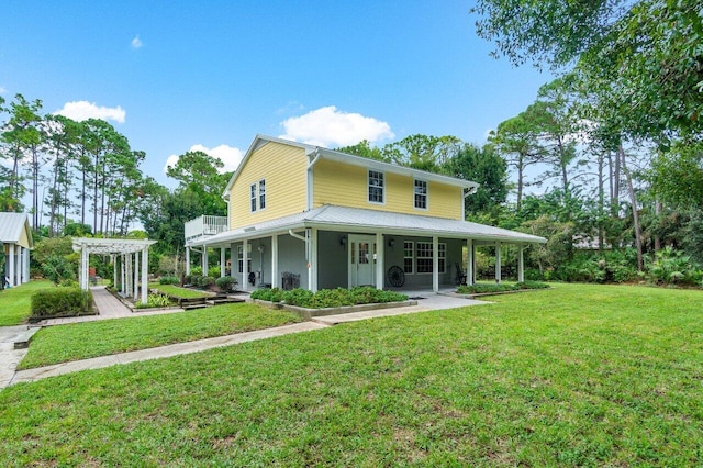 farmhouse with a front yard, a pergola, and covered porch