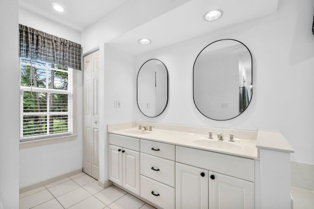 bathroom with tile patterned floors and vanity