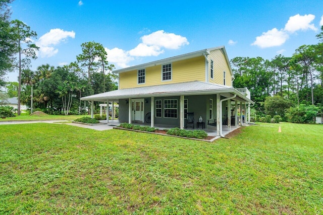 farmhouse inspired home featuring a front lawn and covered porch