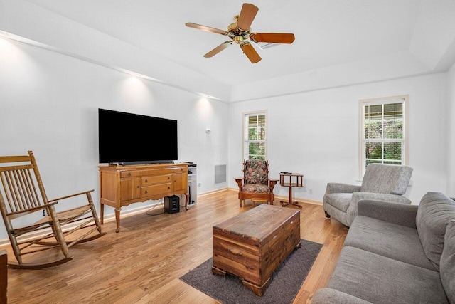 living room with ceiling fan and light hardwood / wood-style floors