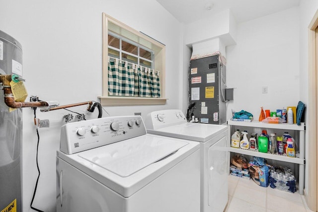 laundry room with light tile patterned flooring, independent washer and dryer, and heating unit