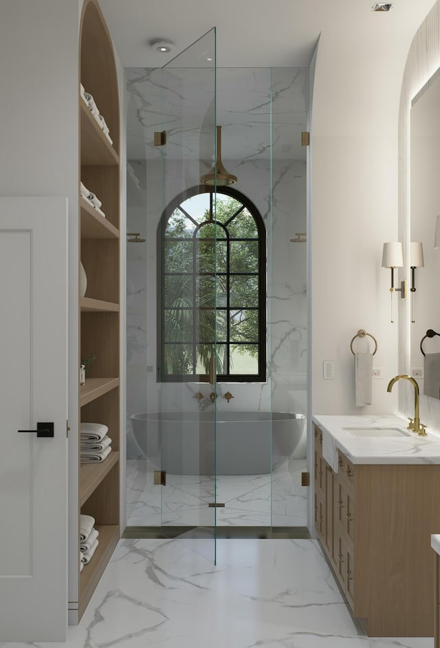 bathroom featuring marble finish floor, vanity, and a marble finish shower