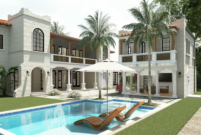 rear view of property featuring a patio, a balcony, stucco siding, and a tile roof