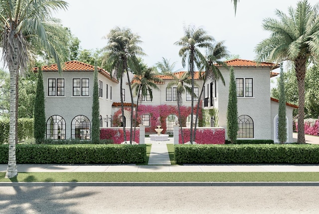 view of front facade featuring stucco siding and a tiled roof