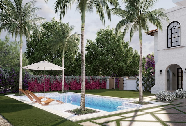 view of pool featuring a yard and a patio area