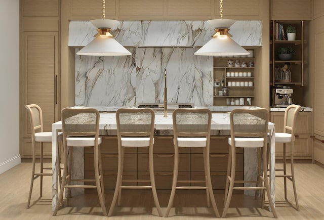 bar featuring tasteful backsplash and light wood finished floors