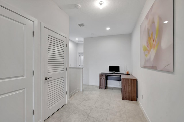 office area with light tile patterned floors, baseboards, visible vents, recessed lighting, and a textured ceiling