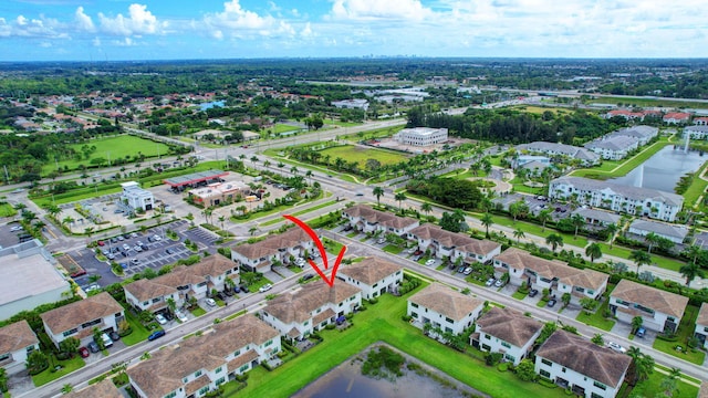 bird's eye view featuring a residential view and a water view