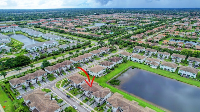 birds eye view of property with a residential view and a water view