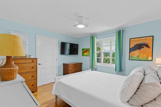 bedroom featuring ceiling fan and light wood finished floors