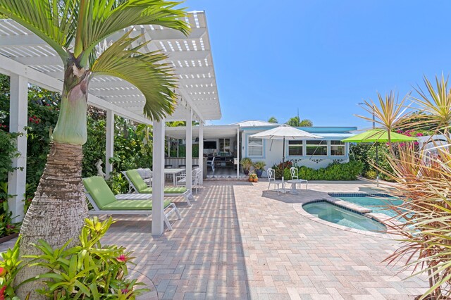 view of pool featuring a pergola, outdoor dining area, a patio, and an in ground hot tub