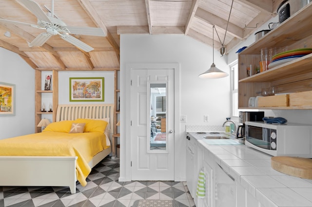 interior space featuring vaulted ceiling with beams, light floors, wood ceiling, and a sink