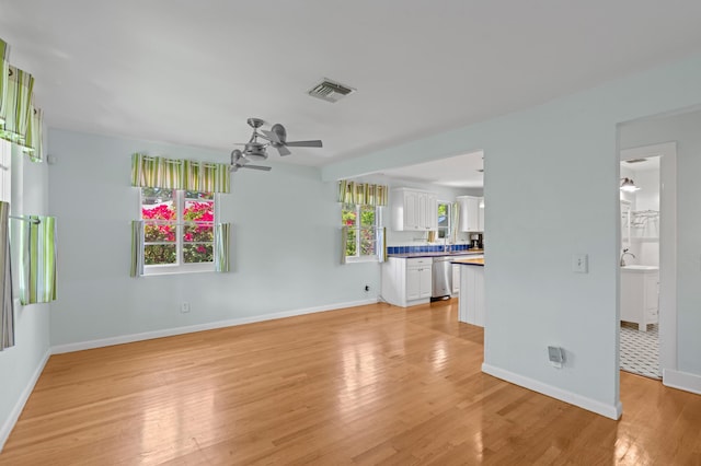 430 N Ocean Breeze, Lake Worth Beach, FL 33460 - unfurnished living room with a ceiling fan and light wood finished floors