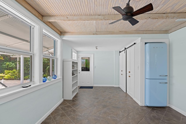 430 N Ocean Breeze, Lake Worth Beach, FL 33460 - unfurnished room with a barn door, a wood ceiling with exposed beams, and a ceiling fan