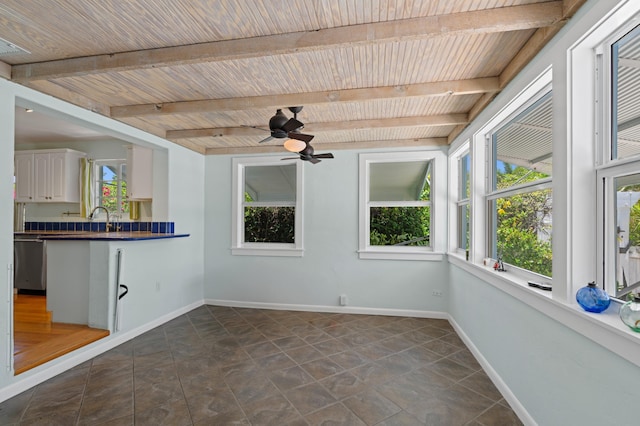 430 N Ocean Breeze, Lake Worth Beach, FL 33460 - unfurnished sunroom featuring a wooden ceiling with exposed beams and baseboards